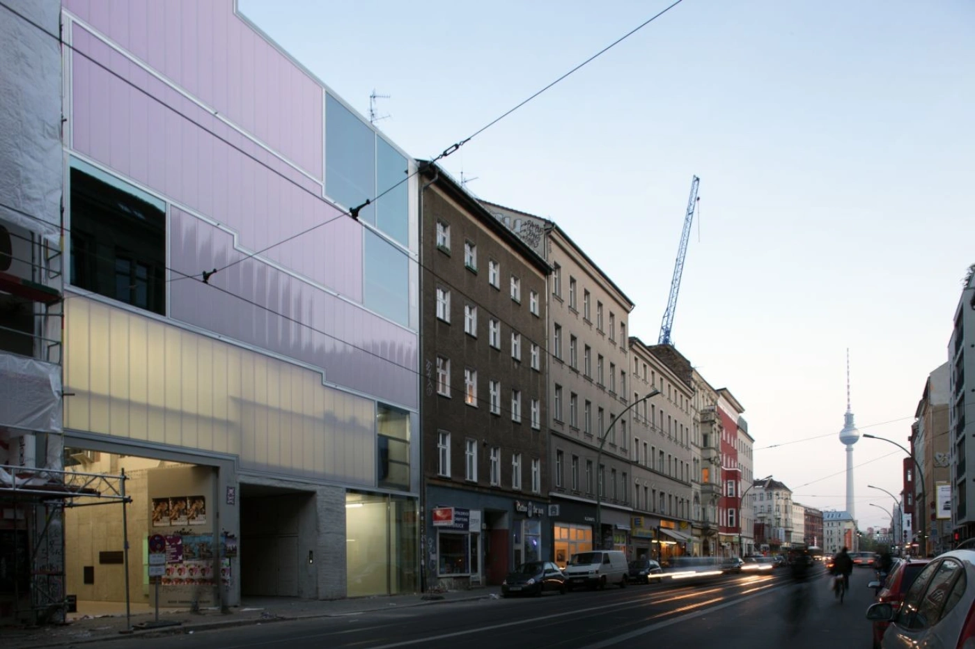 Brunnenstrasse 9 by Brandlhuber+ by Brandlhuber & Emde & Burlon — Street-level perspective of Brunnenstrasse 9 captures the dramatic contrast between the contemporary intervention and existing Berlin fabric.