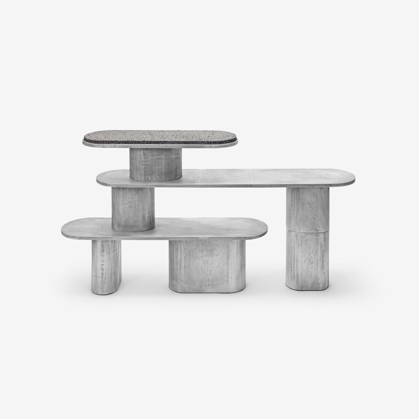 'Structure For Use' by Jeonghwa Seo — A modular concrete seating arrangement composed of cylindrical cast bases supporting rounded tabletops in varying heights.