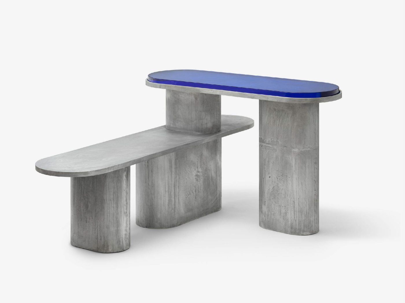 'Structure For Use' by Jeonghwa Seo — A modular seating system combining cast concrete cylindrical legs with a blue glass top surface.