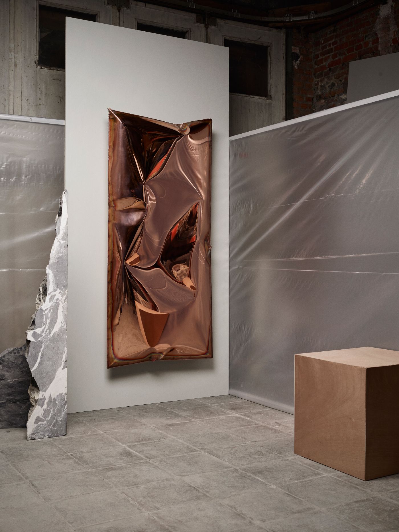 In Hale Wallpiece by Ben Storms — Ben Storms' In Hale wallpiece occupies a gallery corner, its inflated copper sheet suspended against white render.