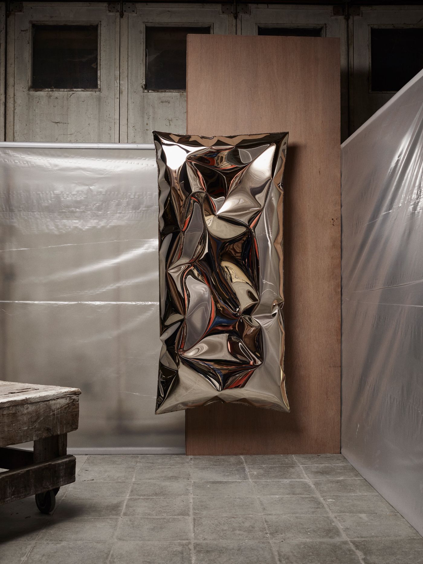 In Hale Wallpiece by Ben Storms — Ben Storms' In Hale Wallpiece hangs against a terracotta panel in an industrial interior.