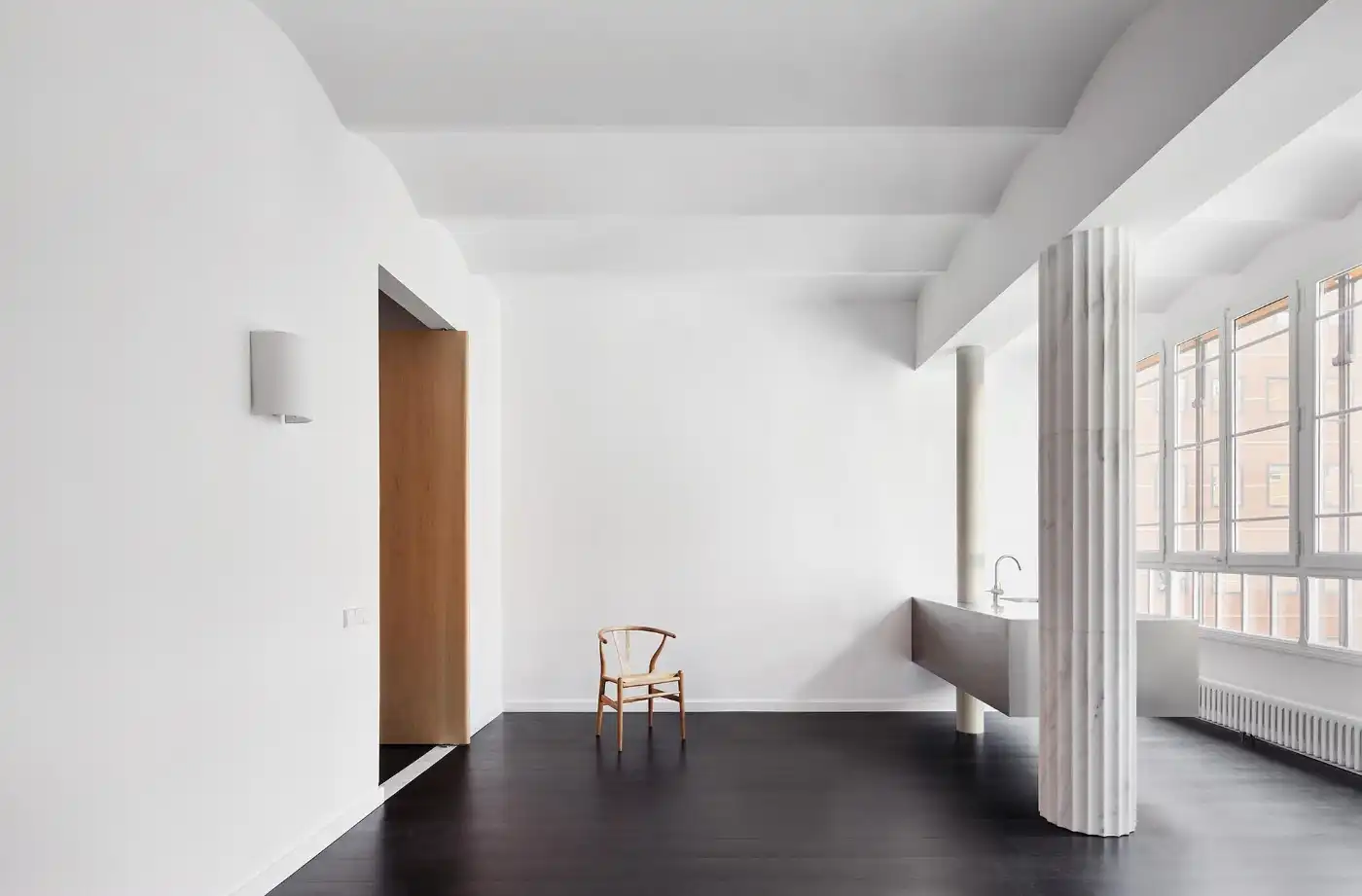 Flat in Eixample by Jaime Prous Architects — A residential interior spanning two connected zones with contrasting spatial qualities.
