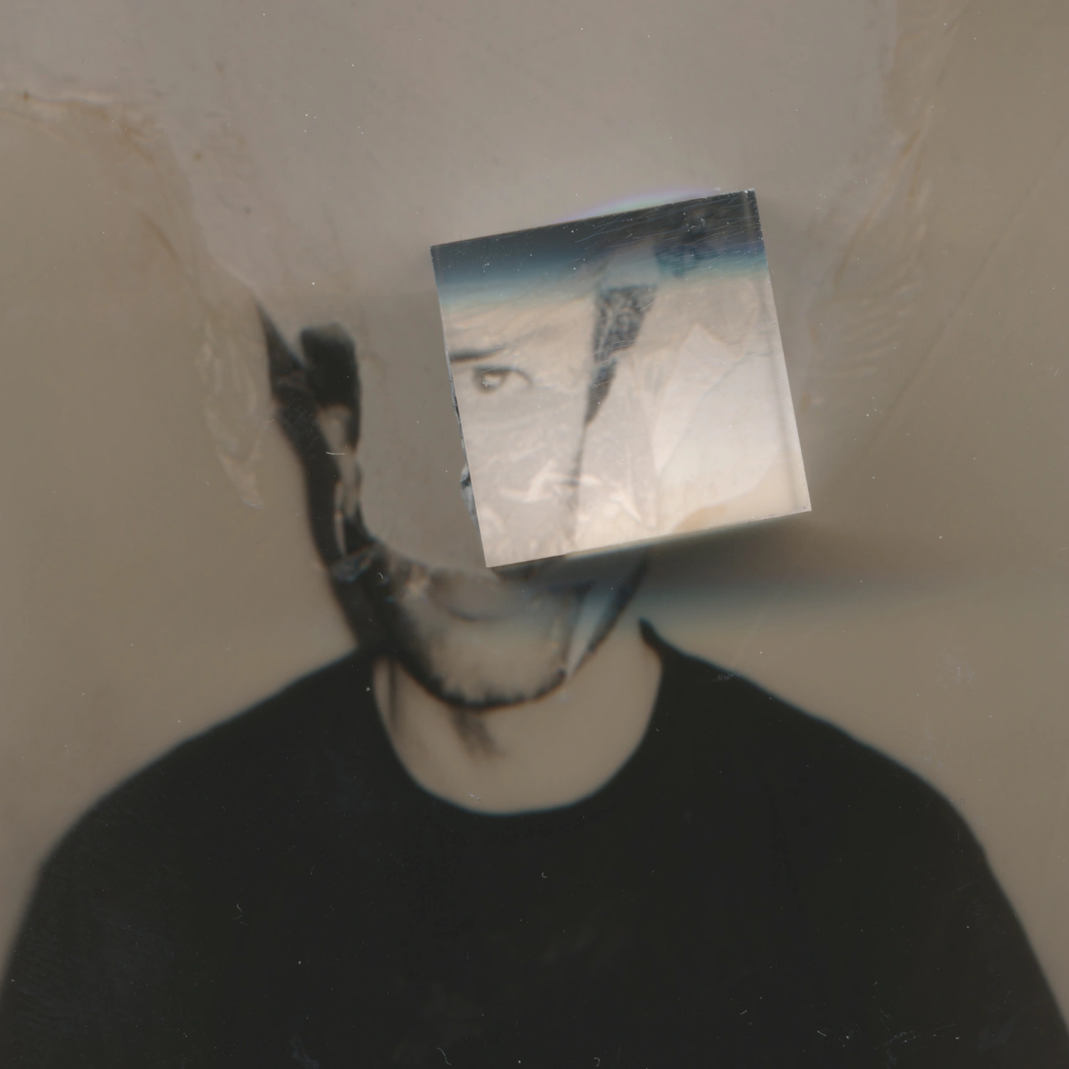 Privacy Portraits by Operator — A portrait obscured by a translucent printed photograph held directly before the subject's face, creating a layered anonymization effect.