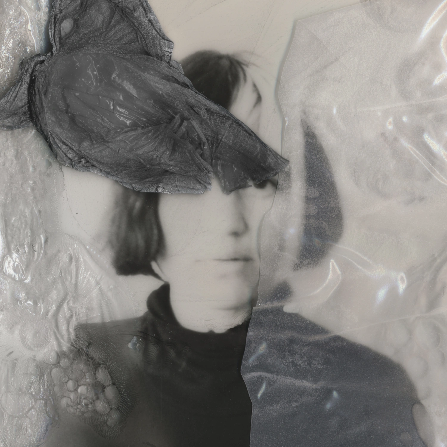 Privacy Portraits by Operator — A monochromatic portrait obscured by vertical ribbed glass positioned in front of the subject's face.