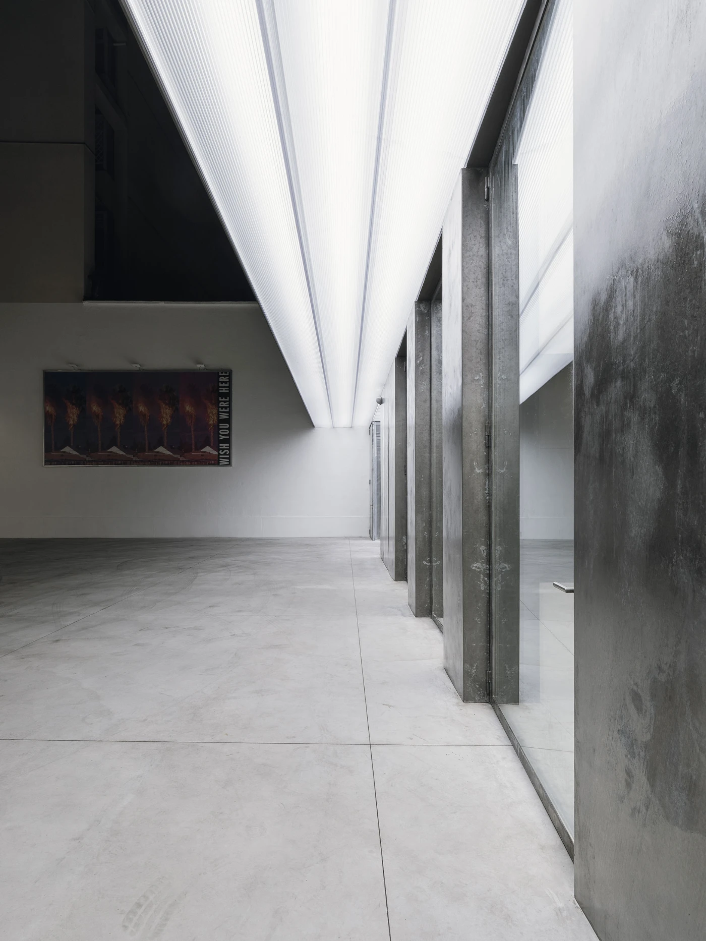 Spazio Maiocchi in Milan — A corridor within Spazio Maiocchi's renovated industrial space demonstrates the venue's commitment to material honesty and spatial clarity.
