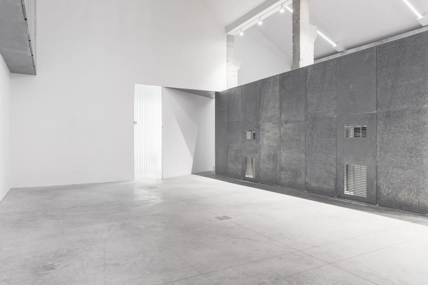Spazio Maiocchi in Milan — The ground-floor gallery presents a spatial threshold marked by contrasting material planes.