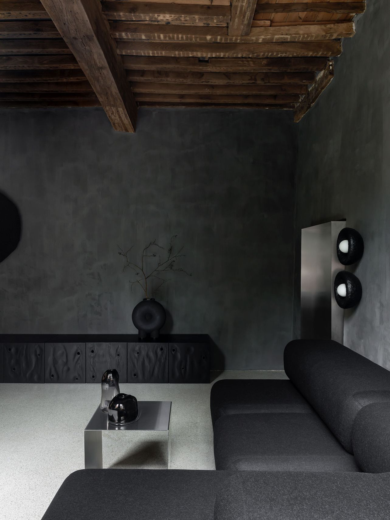 Faina Gallery by Yakusha Studio — Gallery interior capturing the spatial arrangement between foreground seating and background display.