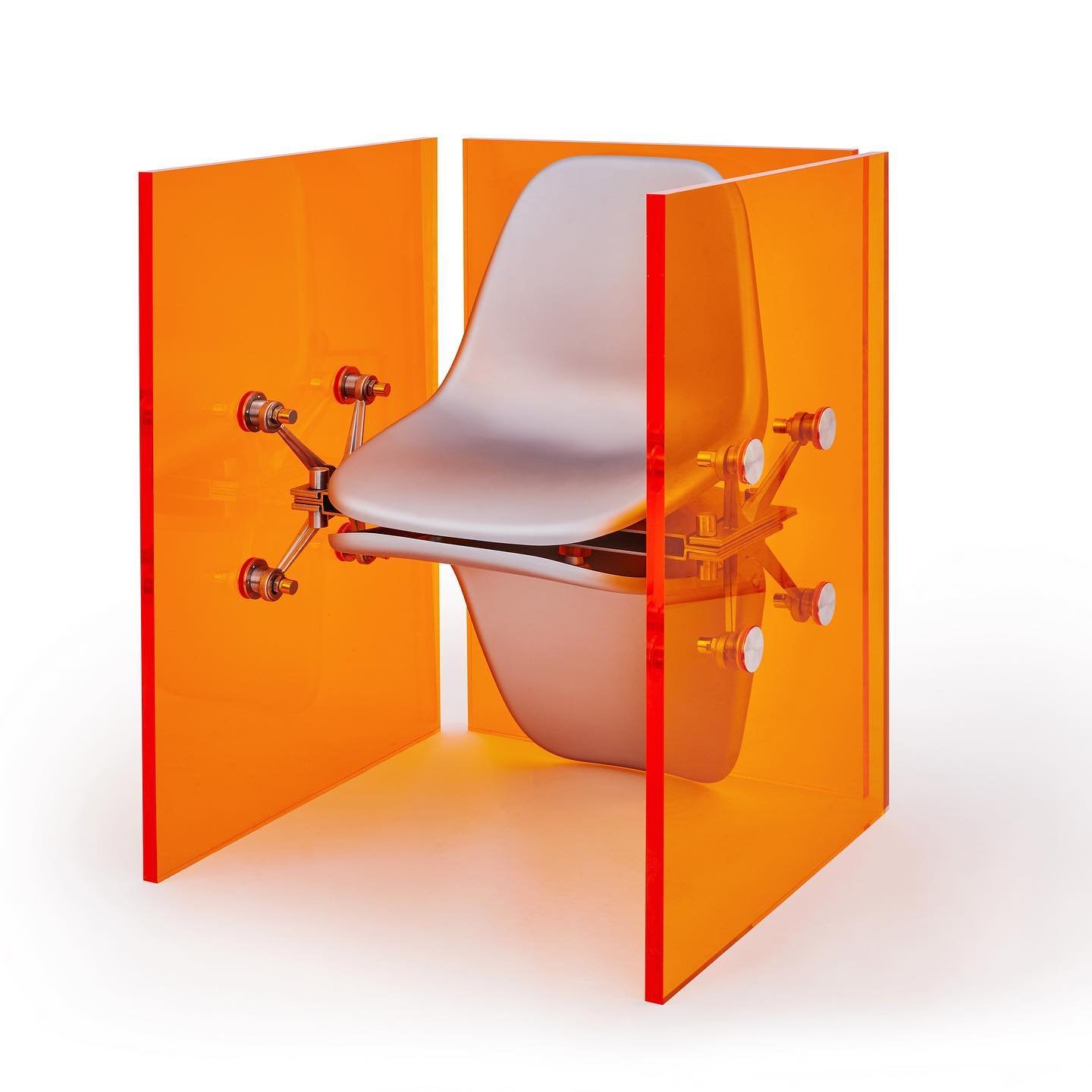 Mixed Public-Private Boundary collection by Cometabolism Studio — A translucent orange polycarbonate enclosure frames a repurposed industrial cylindrical vessel with visible internal mechanical components.