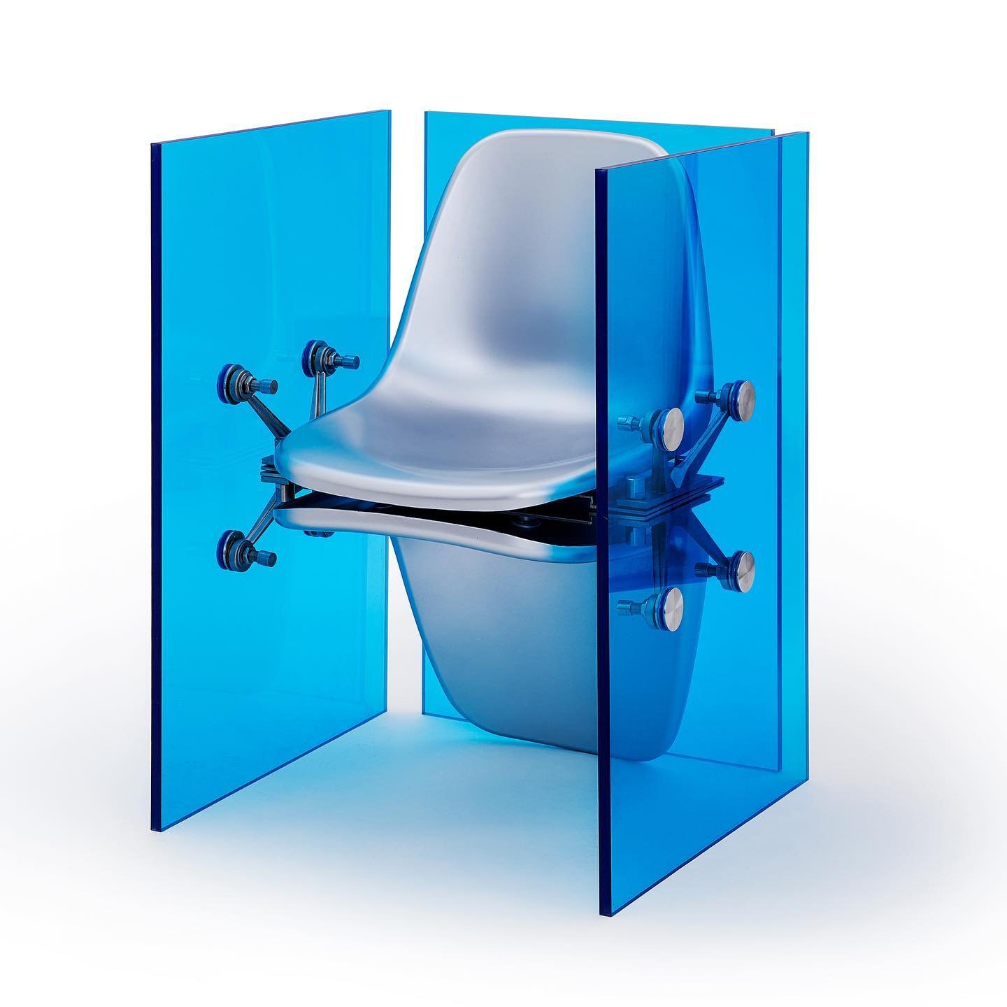 Mixed Public-Private Boundary collection by Cometabolism Studio — A transparent blue acrylic chair structure photographed in isolation against a white background.