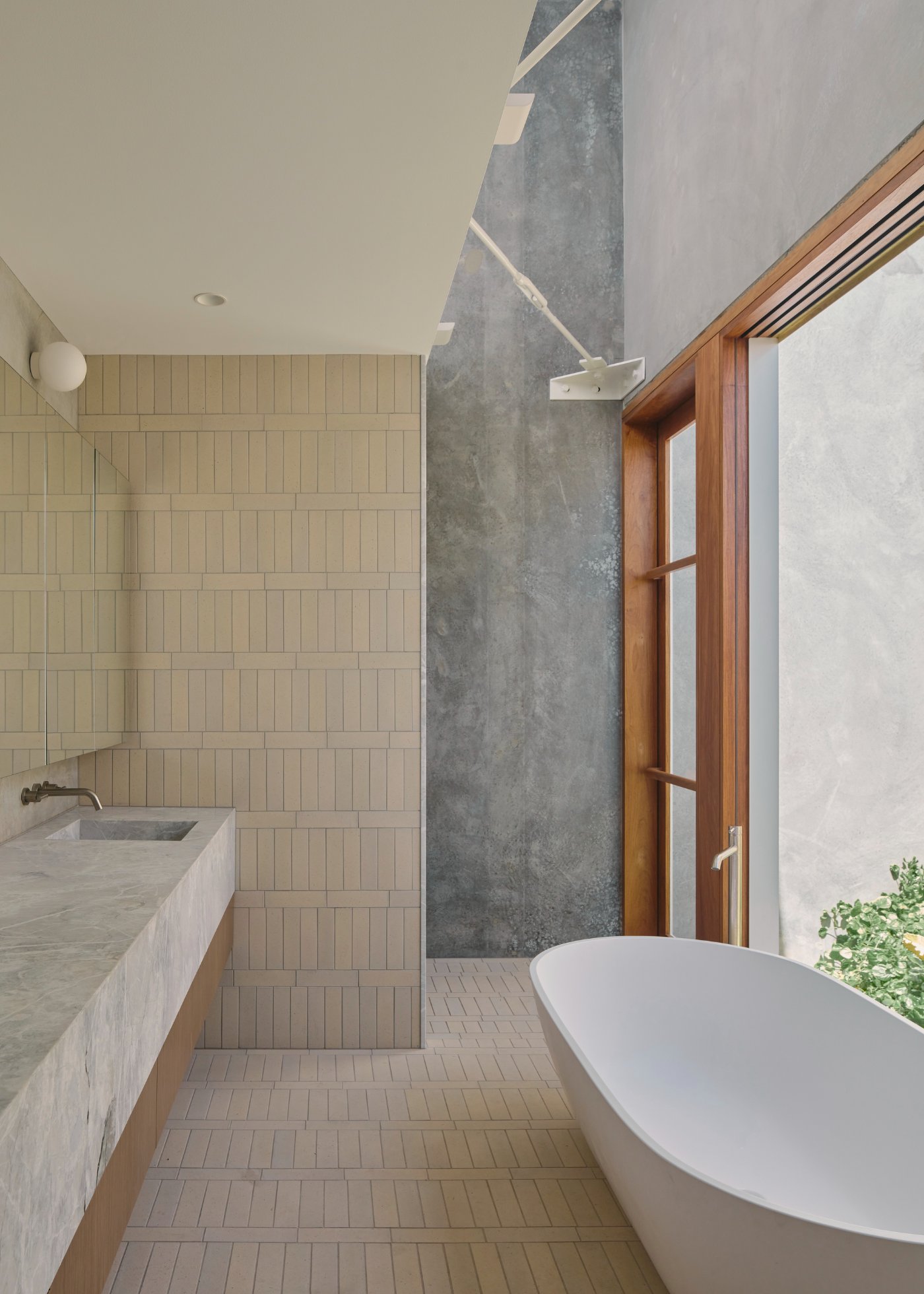 Chelmer River House by Furminger by Christopher Furminger — The ensuite bathroom reveals a restrained material palette organized along a linear axis.