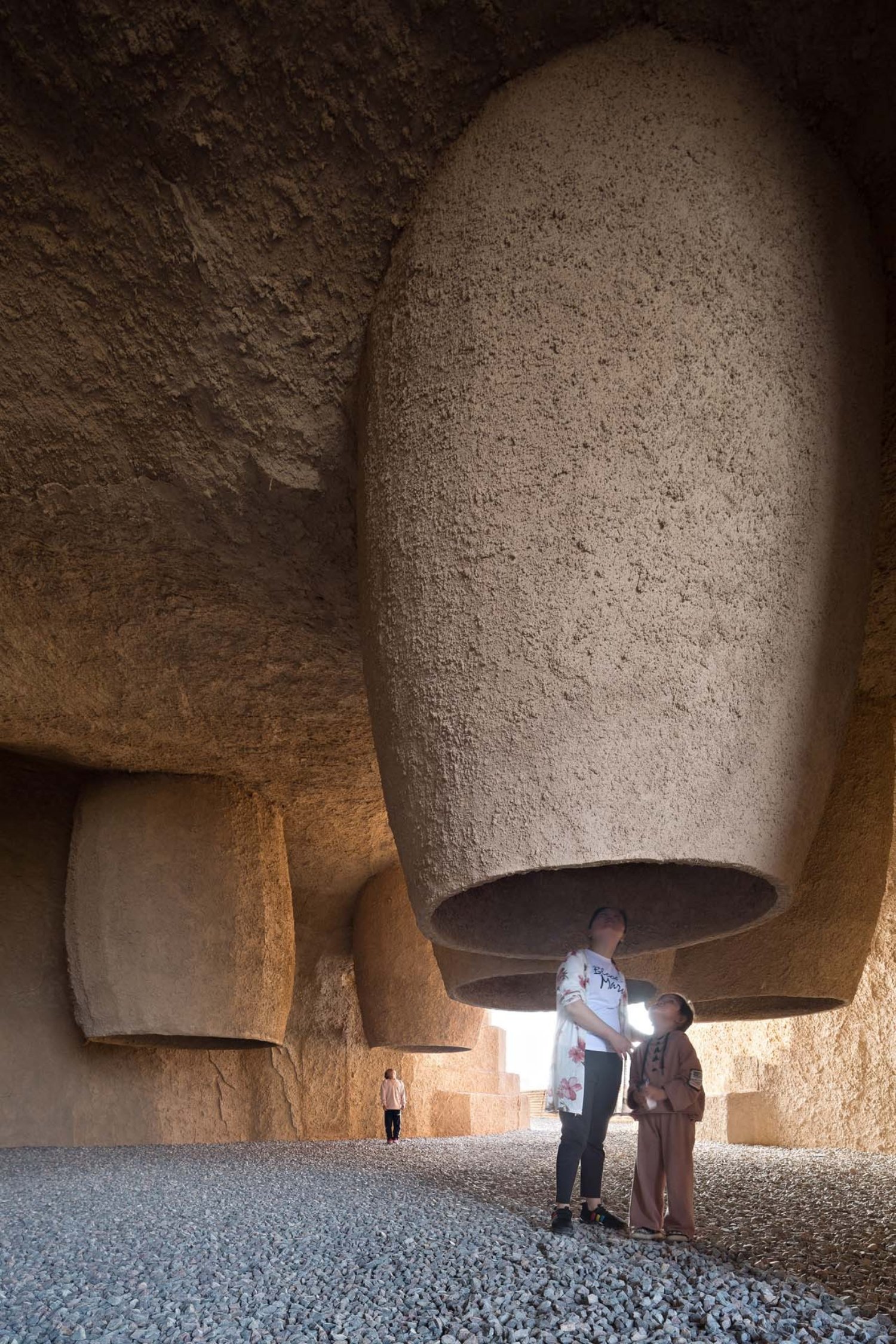 Holy Fire Lit Place in China by URBANUS — Interior passage of the Xihoudu museum carved from monolithic rammed-earth mass.