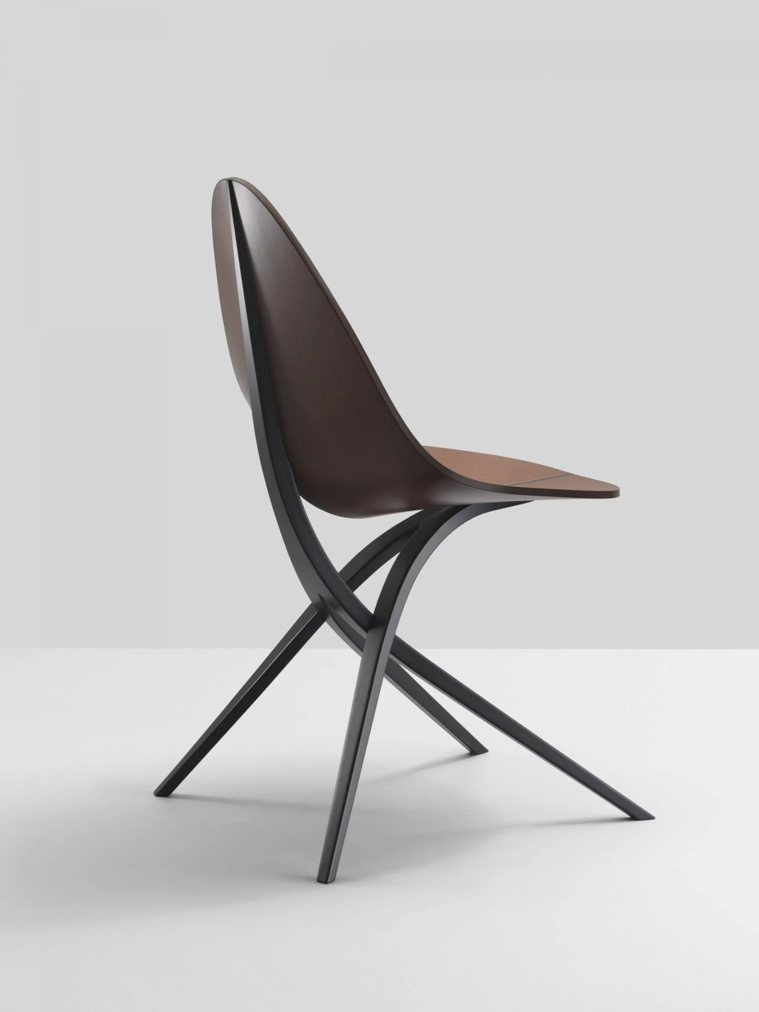 Edaha chair by GamFratesi for Koyori — The Edaha chair is photographed in three-quarter view against a neutral ground, isolating the design's formal geometry.
