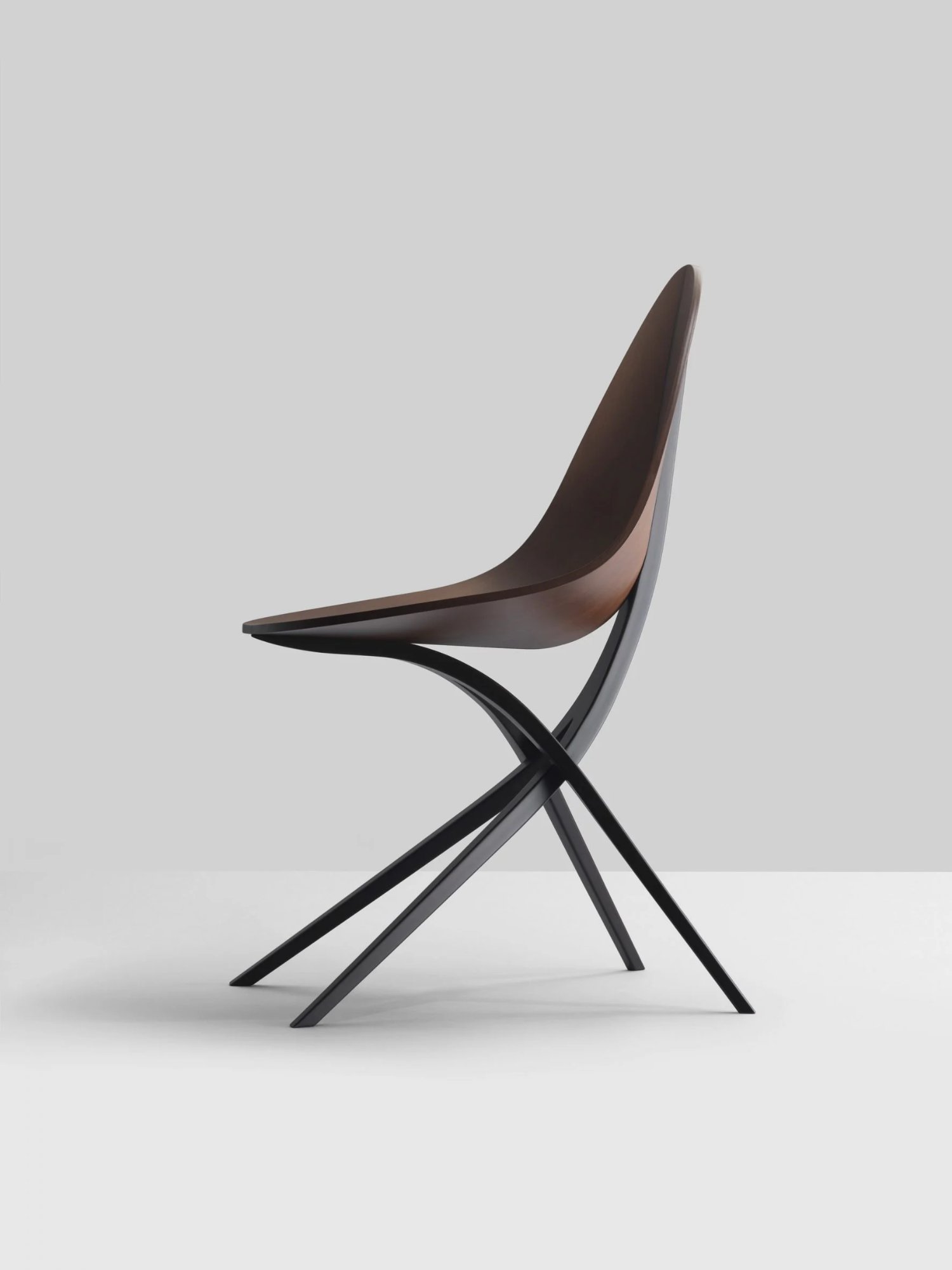 Edaha chair by GamFratesi for Koyori — The Edaha chair is photographed in profile against a neutral background, isolating the designer's biomorphic vocabulary.