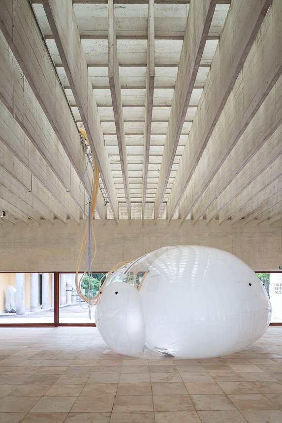 Another Generosity — Nordic Pavilion at the 2018 Venice Biennale by Eero Lundén — Two connected inflatable membrane forms with organic bulbous geometry occupy the Nordic Pavilion's austere interior.