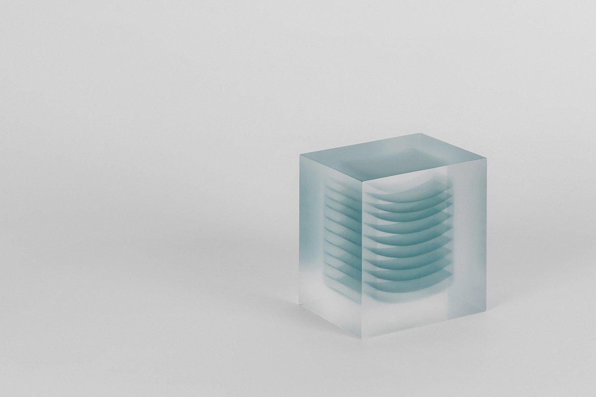 Block Series by Rahee Yoon — A translucent acrylic block sculpture containing internal layered forms rendered in graduated blue tones.