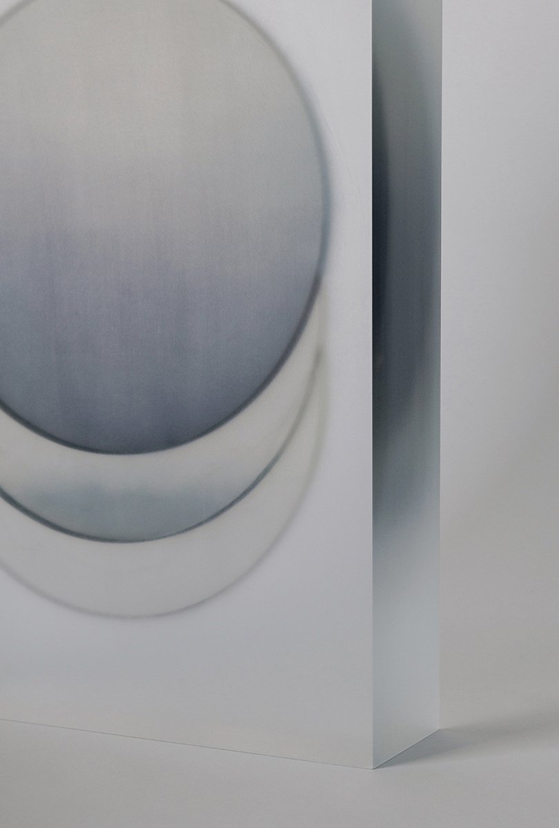 Block Series by Rahee Yoon — A translucent acrylic block positioned at a three-quarter angle reveals layered internal geometries rendered in graduated blue tones.