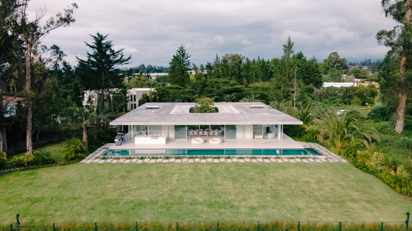 Magnolia House by Estudio Felipe Escudero — Magnolia House presents as a single-story horizontal volume anchored to its landscape through a monolithic concrete structure.