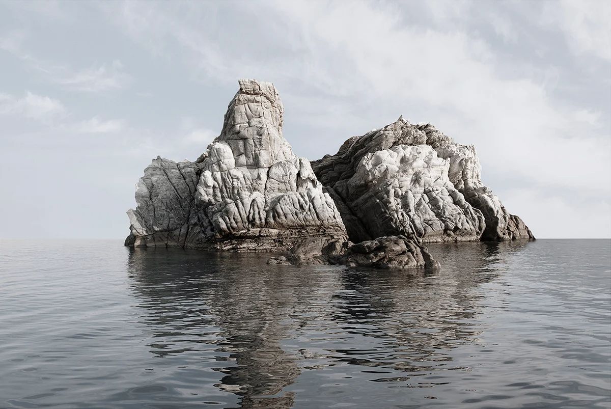 Island Hoping by Christina Dimitriadis — Two adjacent granite rock formations rise from calm Mediterranean water in a low-angle composition.
