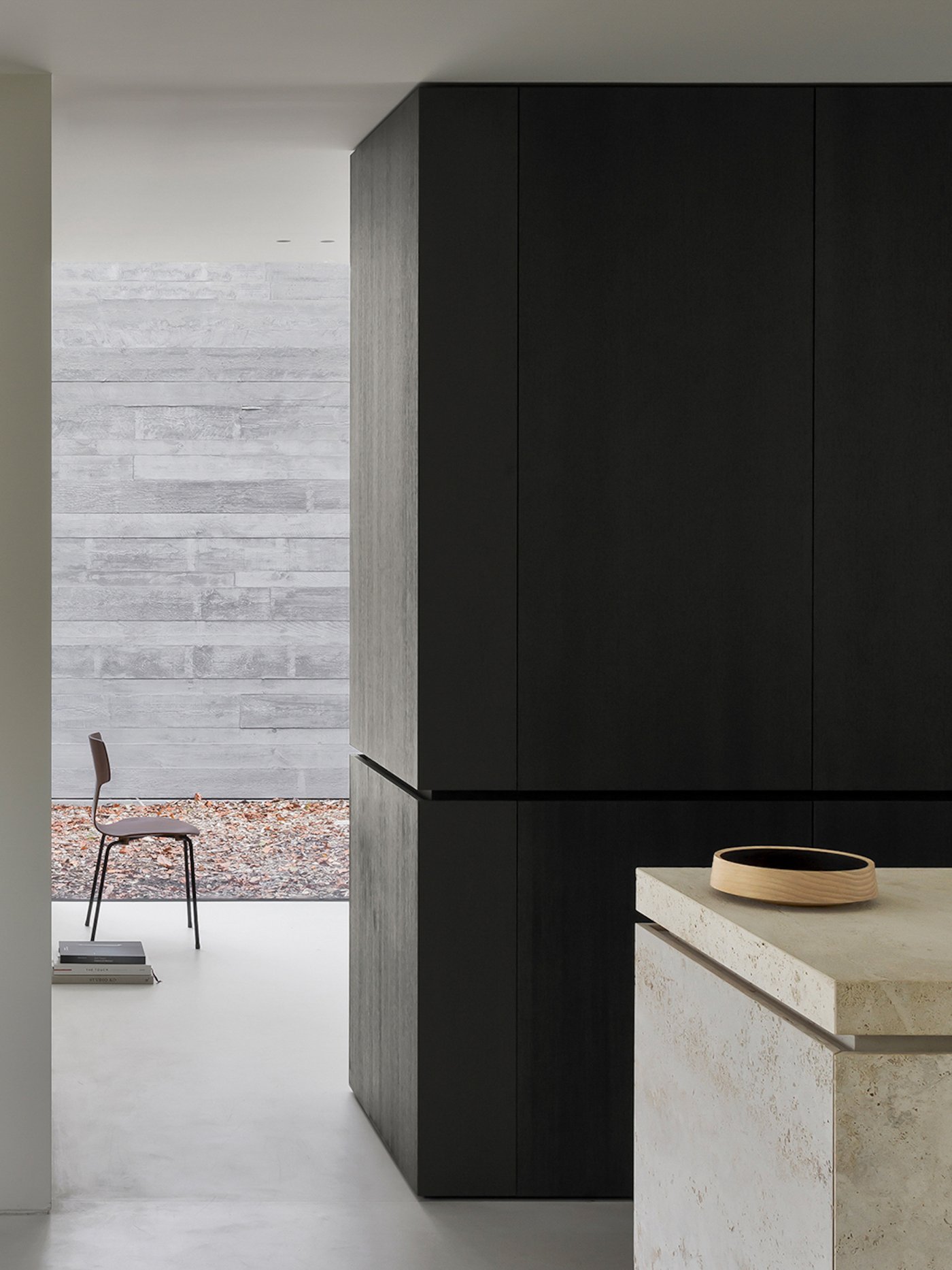 Villa BA by gosseye + verbeke — A threshold view into Villa BA's interior reveals the project's dual-facade strategy in material terms.