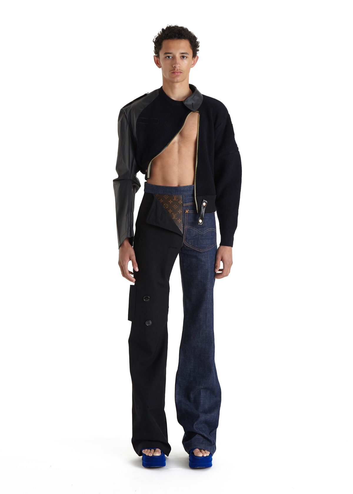 SSAW22 by Duran Lantink — Duran Lantink's SSAW22 collection demonstrates asymmetrical deconstruction through a black knit dress featuring diagonal cutouts that expose the torso and...