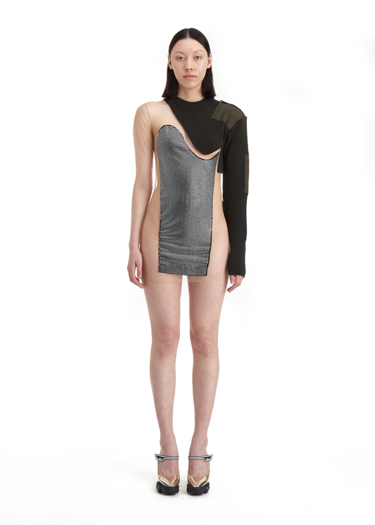 SSAW22 by Duran Lantink — A hybrid garment constructed from contrasting knit fabrics demonstrates Lantink's zero-waste aesthetic through deliberate asymmetry.