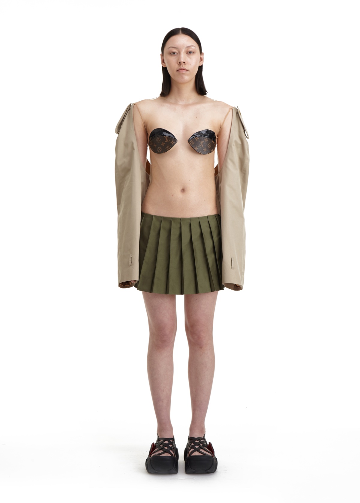 SSAW22 by Duran Lantink — Duran Lantink's SSAW22 collection presents a deconstructed silhouette combining unexpected material juxtapositions: a beige oversized blazer with extended...