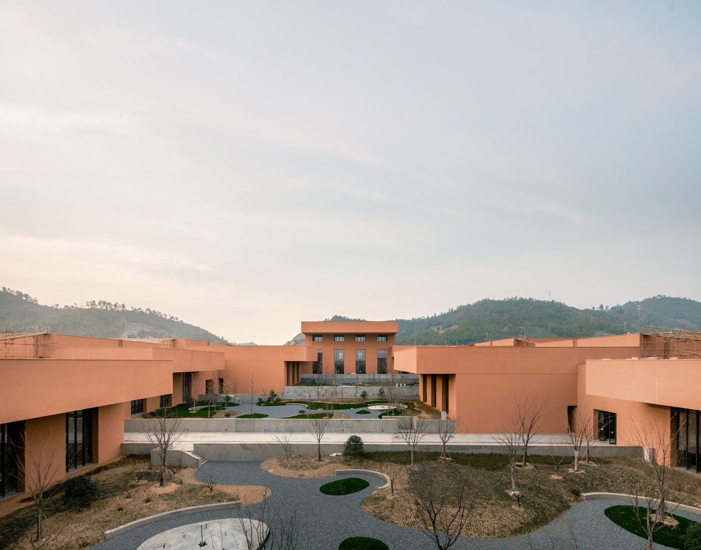 Zhejiang Museum of Natural History by David Chipperfield Architects — David Chipperfield's Zhejiang Museum of Natural History presents a monumental rendered concrete gateway defining the threshold between cultivated and wild...