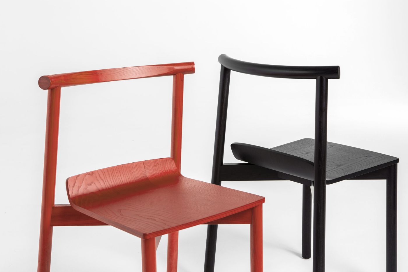 Wox collection by Pavel Vetrov for Artu — The Wox collection presents two stackable chairs in contrasting finishes, photographed against a white ground.