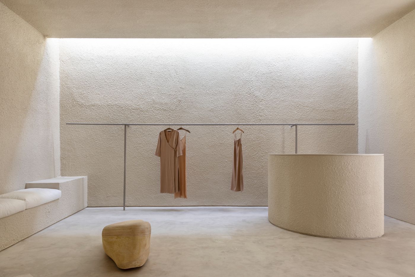 Haight Clothing Store by Entre Terras & Pablo Resende — A minimalist retail interior defined by a choreographed spatial sequence.