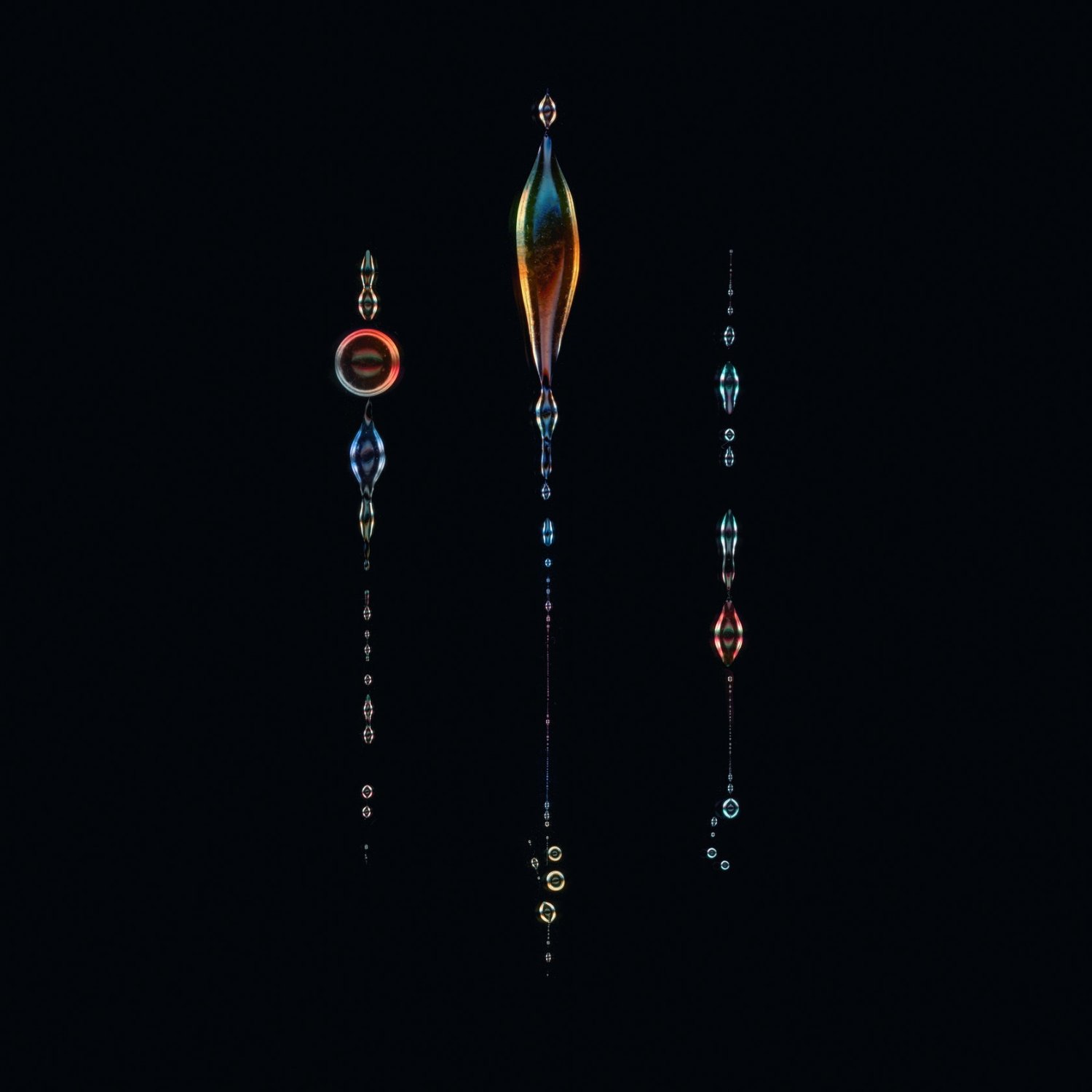 Selected works by Nigel Evan Dennis — Digital artwork featuring three vertical compositions arranged against a black void.