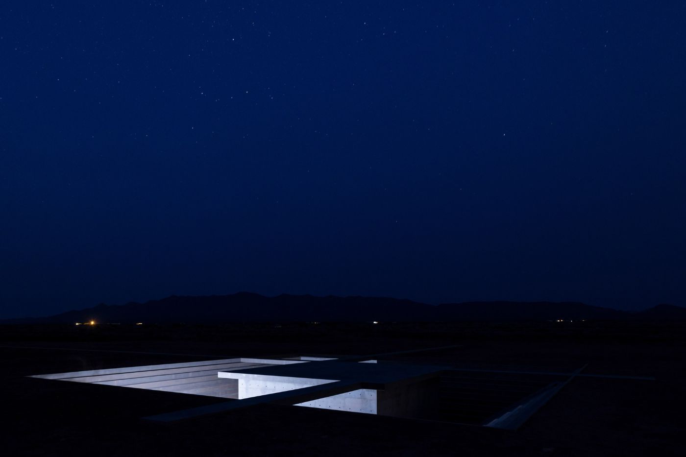 McNeal 020 Pavilion by Atelier David Telerman — Photographed at dusk, the McNeal 020 Pavilion reveals its concrete geometry through a low-angle vantage point.