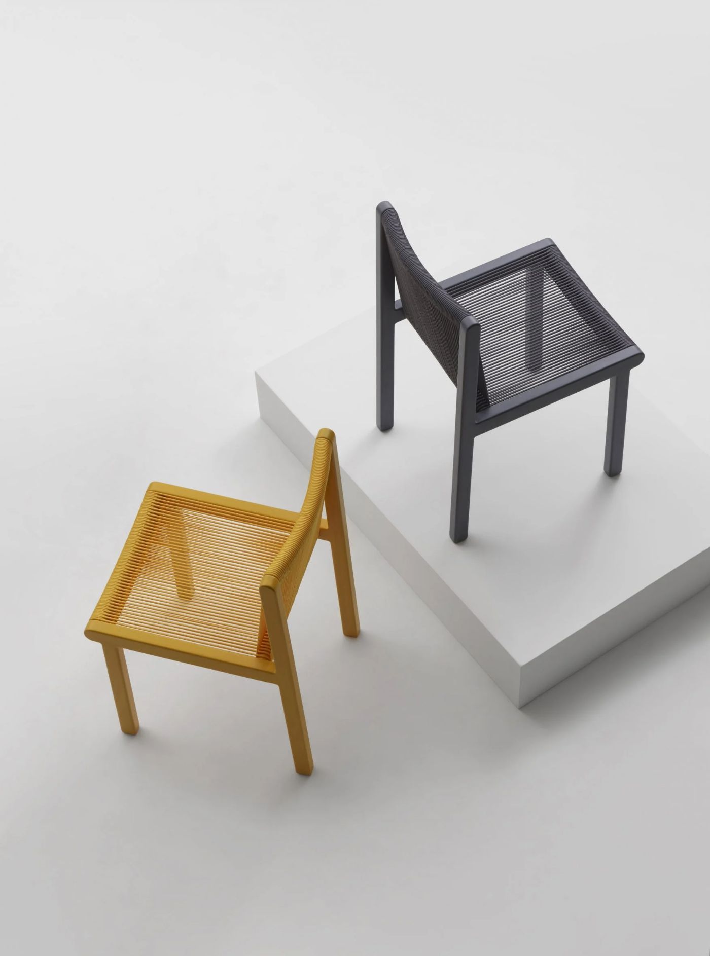 FILO CHAIR by Ronan & Erwan Bouroullec for Mattiazzi by Ronan and Erwan Bouroullec — Three iterations of the Filo chair display the design's material and chromatic range in isometric presentation.