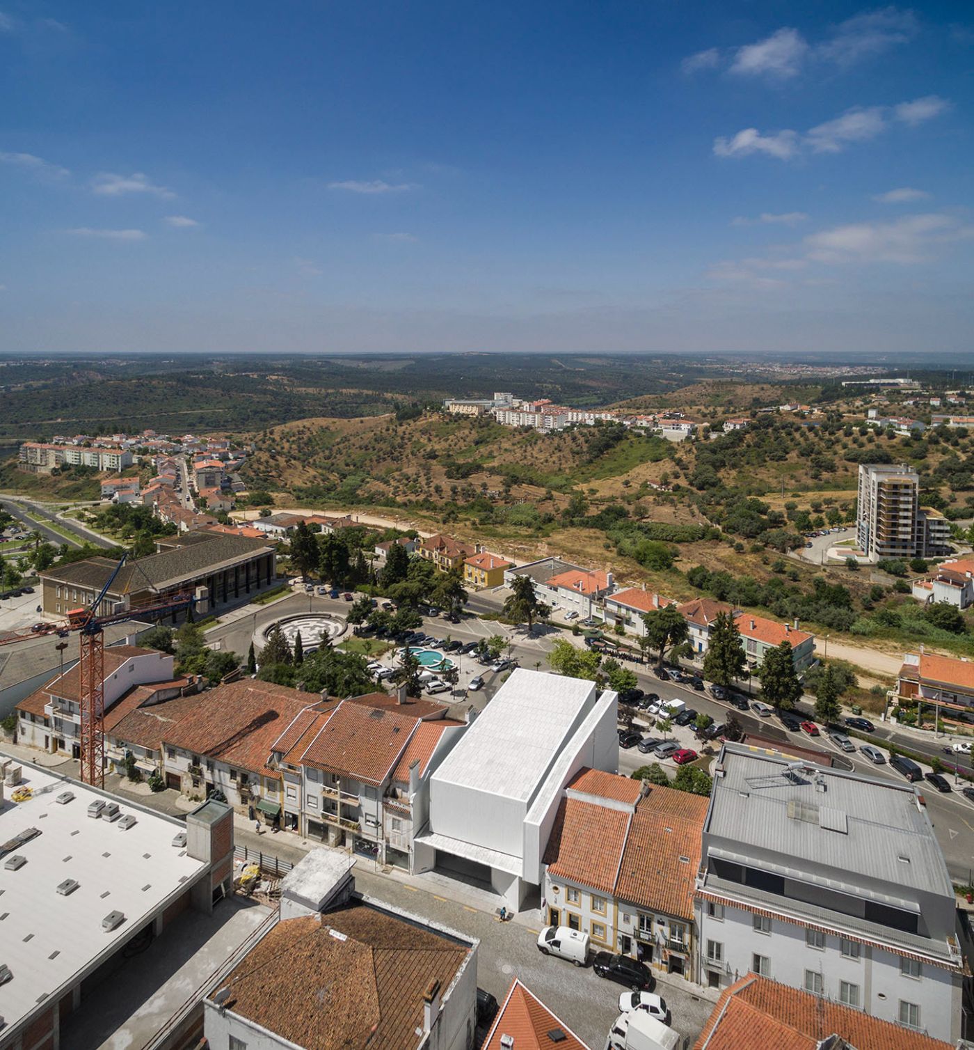 Abrantes Municipal Market by ARX Portugal — Aerial perspective of ARX Portugal's Abrantes Municipal Market reveals its integration into the hillside settlement.