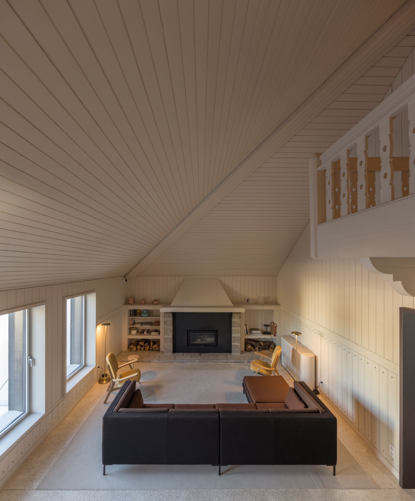 Casa de São Lourenço by P-06 Atelier and Site Specific by P-06, Site Specific, Rogério de Azevedo — A pitched-roof attic space lined entirely in white vertical timber paneling, creating continuous linear rhythm across ceiling and walls.
