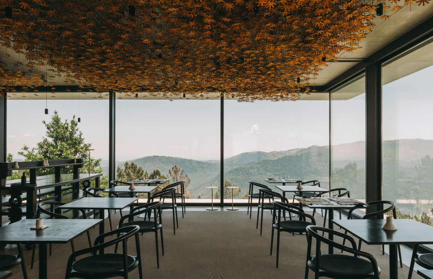 Casa de São Lourenço by P-06 Atelier and Site Specific by P-06, Site Specific, Rogério de Azevedo — Dining pavilion with floor-to-ceiling glazing framing mountainous landscape at 1,250-meter elevation.