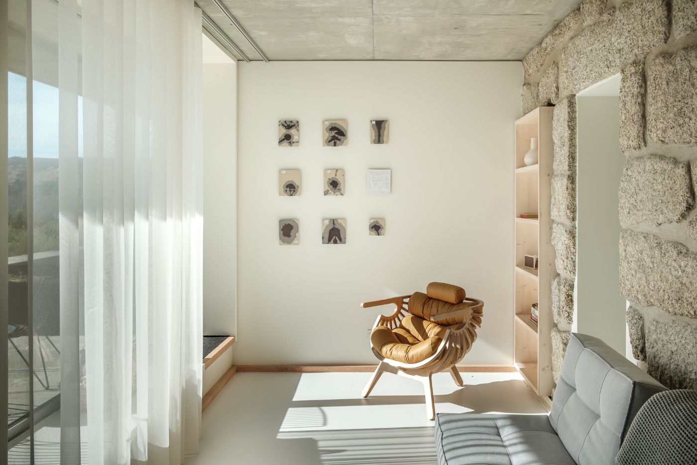 Casa de São Lourenço by P-06 Atelier and Site Specific by P-06, Site Specific, Rogério de Azevedo — A guest room at Casa de São Lourenço demonstrates the hotel's restrained material palette and connection to landscape.