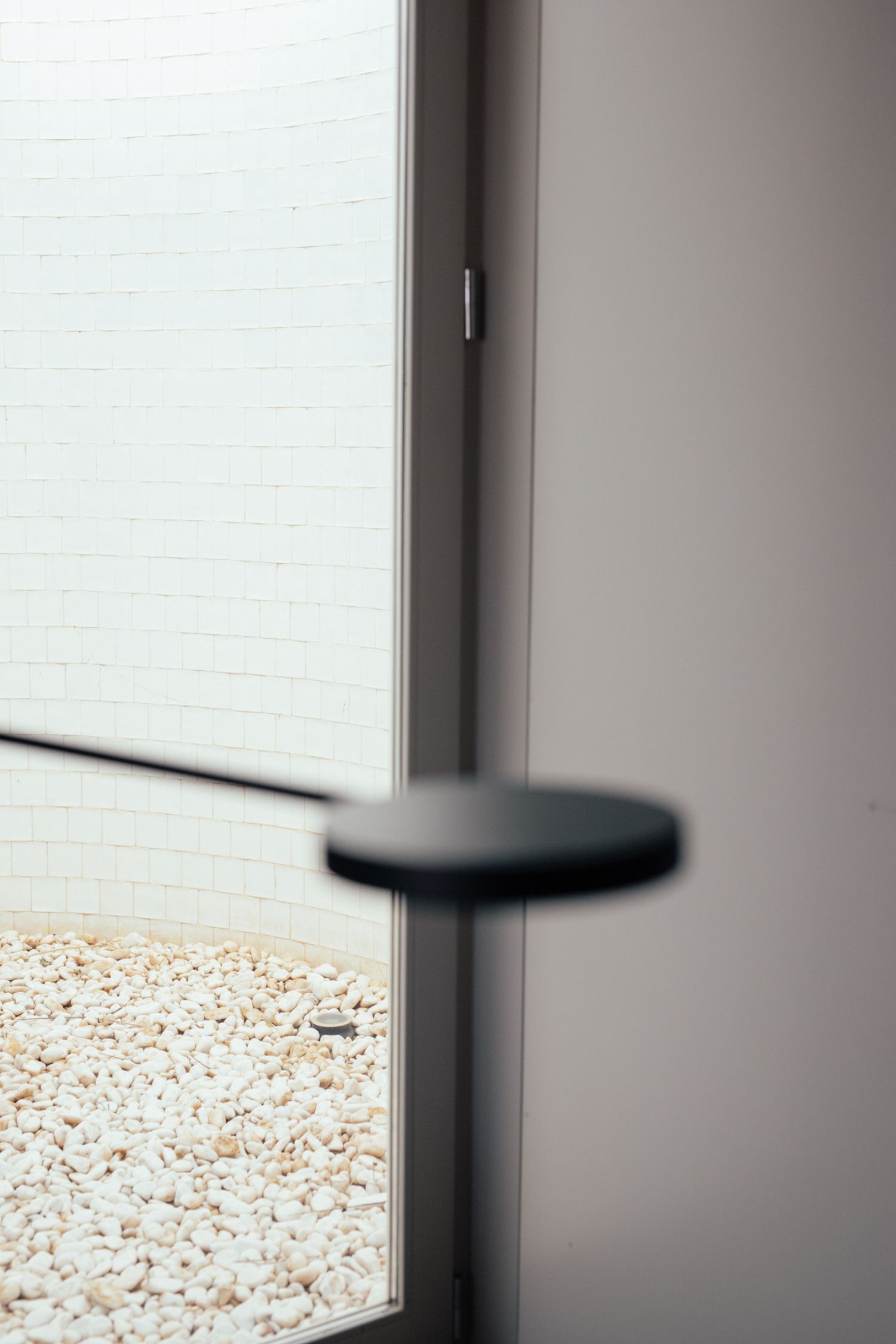 Casa na Terra captured by Thisispaper Studio — A threshold detail from Casa na Terra captures the materiality of Aires Mateus's design language.