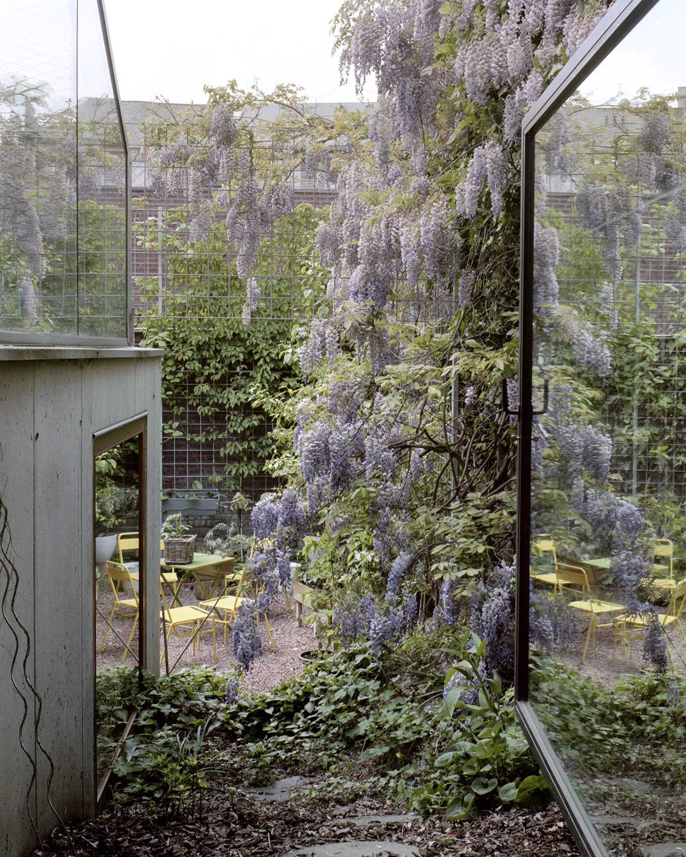‘Room in the City’ by 51N4E — A view through open thresholds reveals layered interior and exterior spaces.