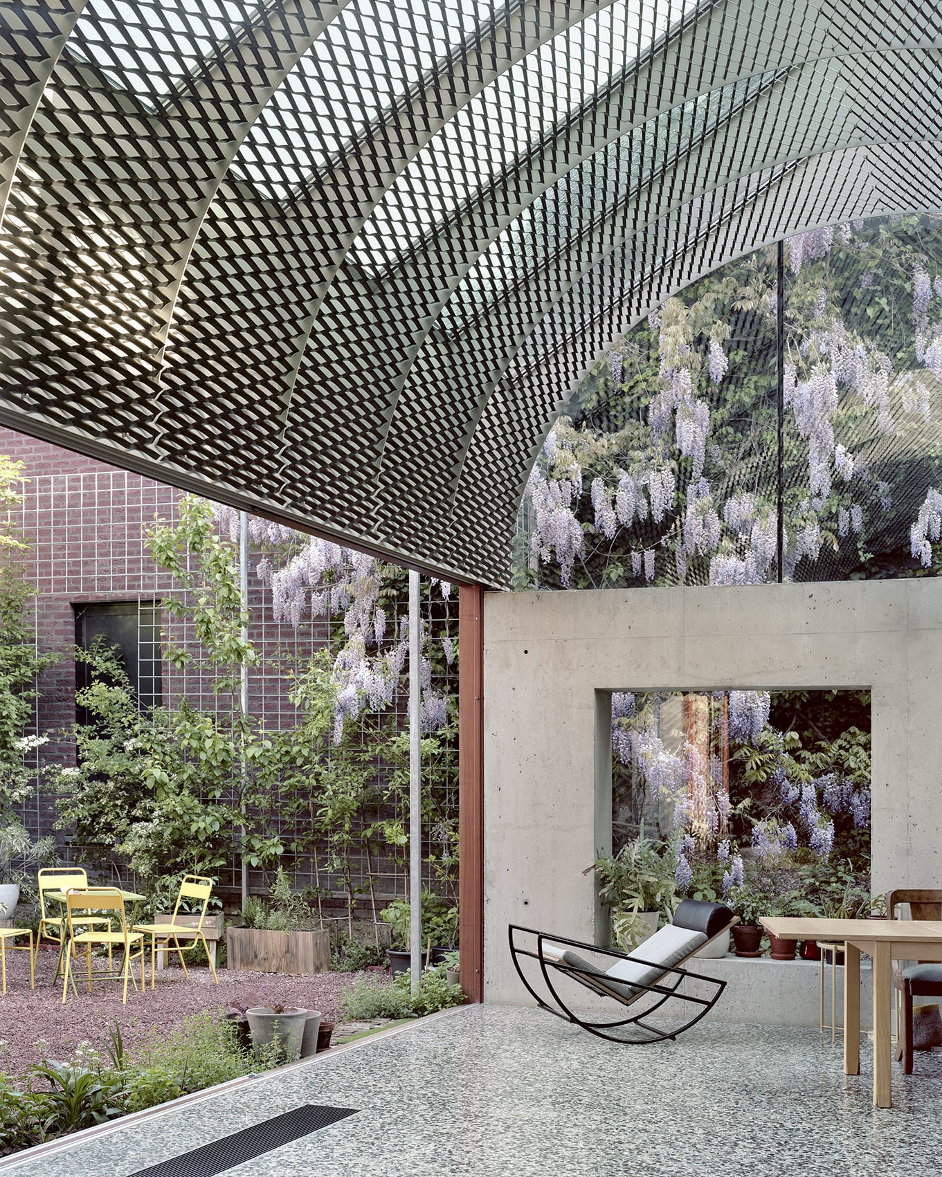 ‘Room in the City’ by 51N4E — A threshold space within 'Room in the City' reveals the project's orchestration of connected interior and exterior zones.