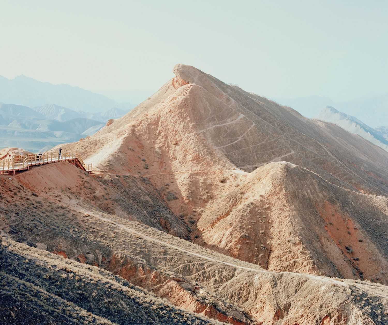 Universal Experience by Catherine Hyland — Catherine Hyland documents a monumental earthen pyramid structure engineered as a tourist destination in China's arid landscape.