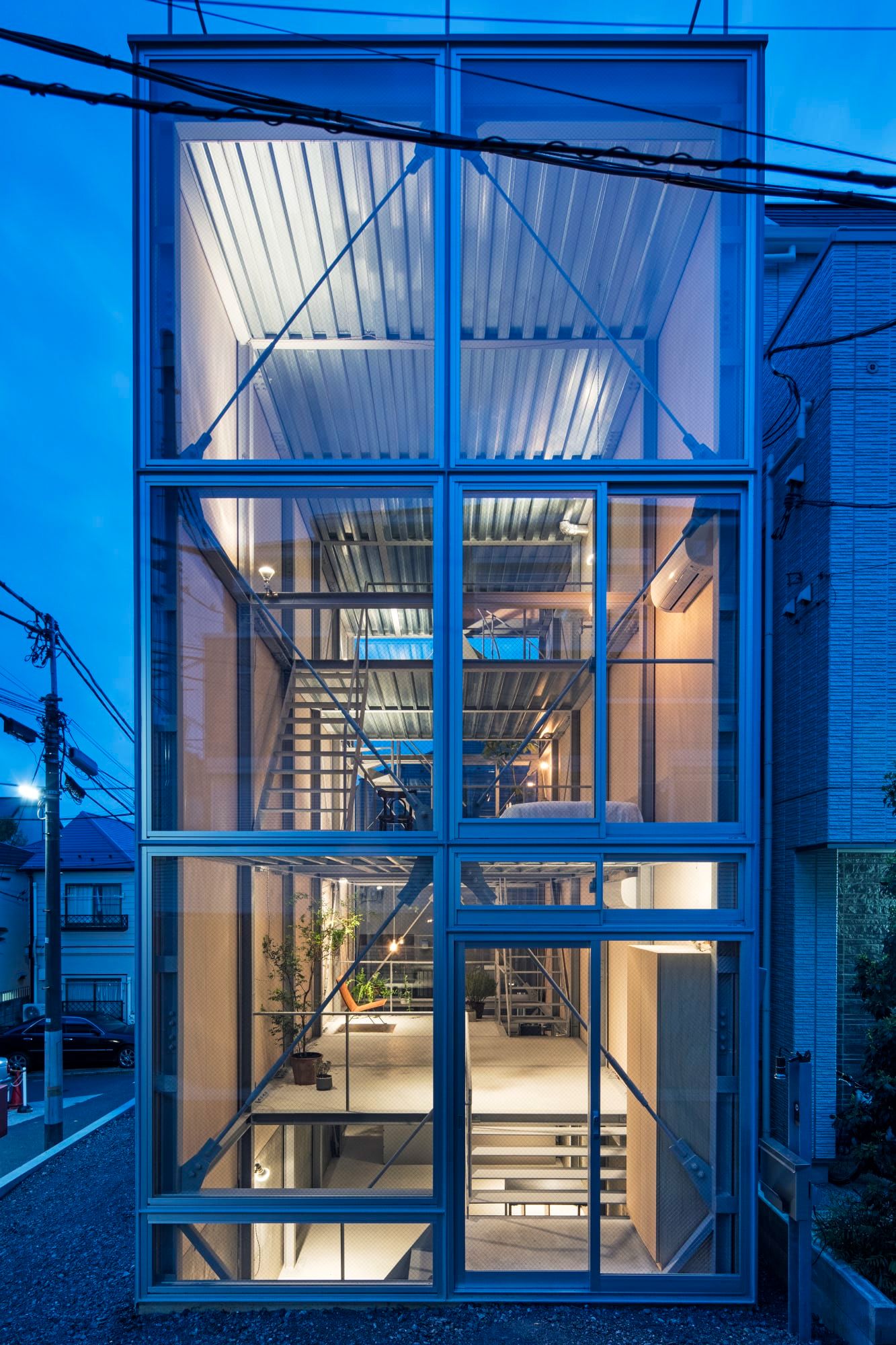 Ebisu No Ie by Tetsuo Yamaji Architects — Twilight photograph of the facade revealing the modular steel lattice structure at full depth.
