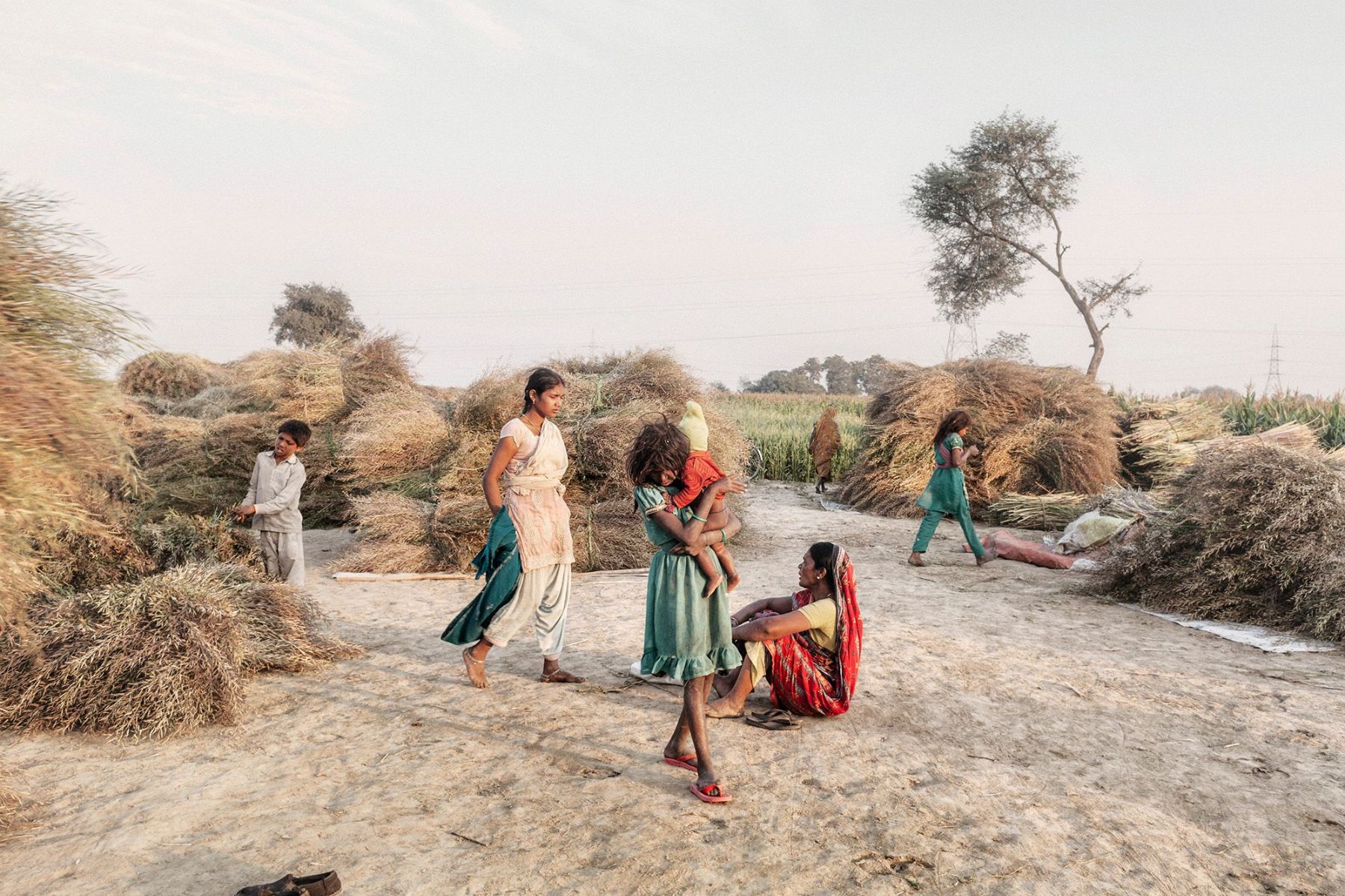 Ganga Ma by Giulio Di Sturco — A village settlement along the Ganges basin reveals daily life amid agricultural infrastructure.