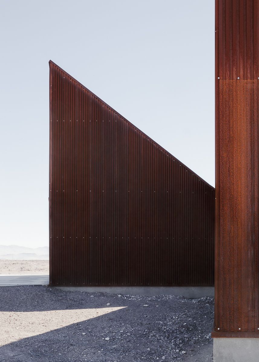 Center of Interpretation of the Desert by Emilio Marín and Juan Carlos López — A single corrugated corten steel volume dominates the frame, its angled roof plane sloping downward from left to right in reference to the surrounding...