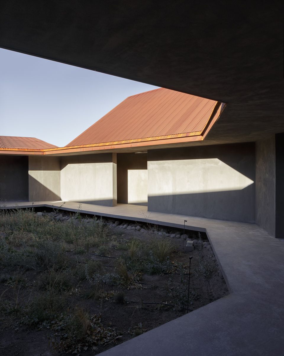 Center of Interpretation of the Desert by Emilio Marín and Juan Carlos López — A low-angle view of the Center of Interpretation reveals the building's geometric clarity against the Atacama's barren landscape.