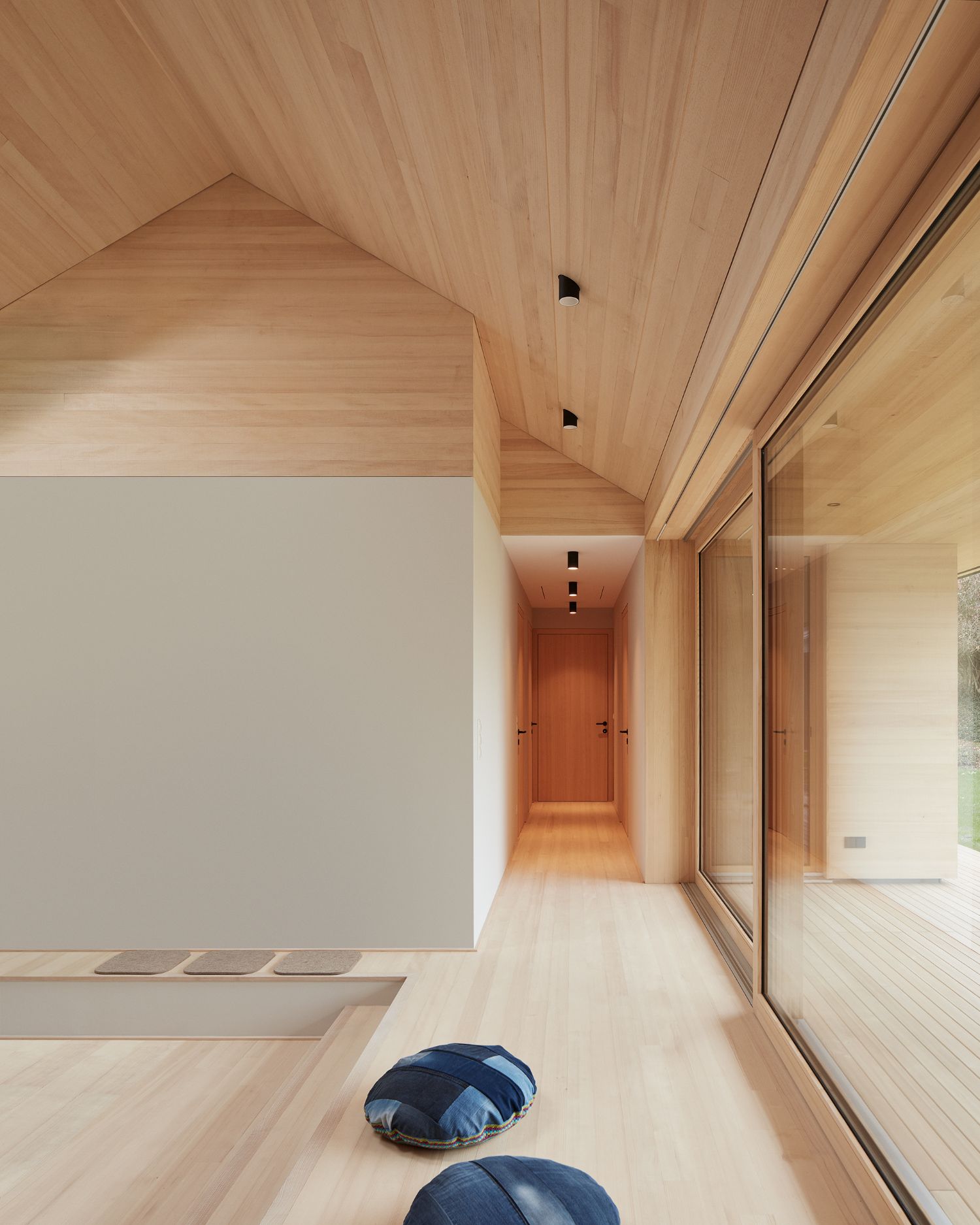 House ZF by Bernd Riegger — A corridor in House ZF stretches toward a distant orange-toned doorway, lined with natural timber flooring and ceiling.