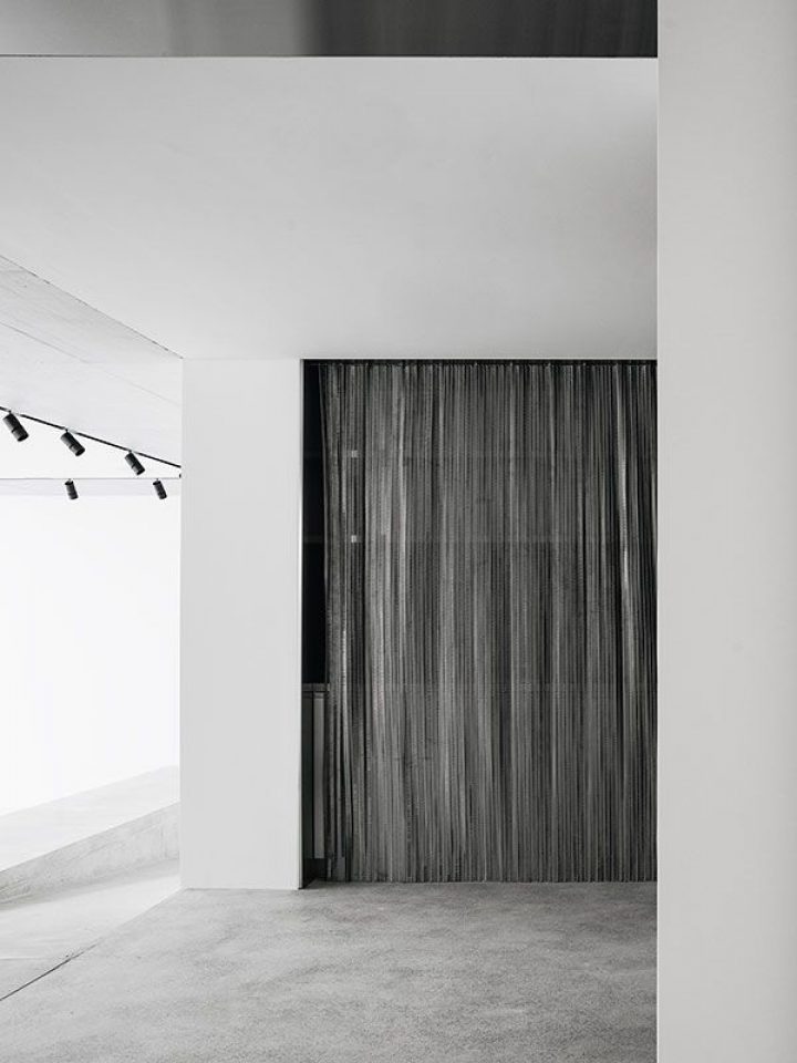 House for an Art Collector by Think Architecture — A threshold moment captured in monochromatic clarity.