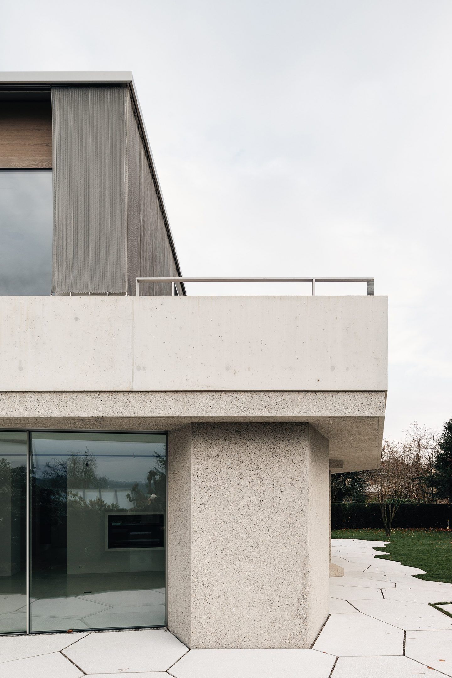 House for an Art Collector by Think Architecture — Ground floor detail of the House for an Art Collector featuring the junction between exterior paving and concrete structural wall.