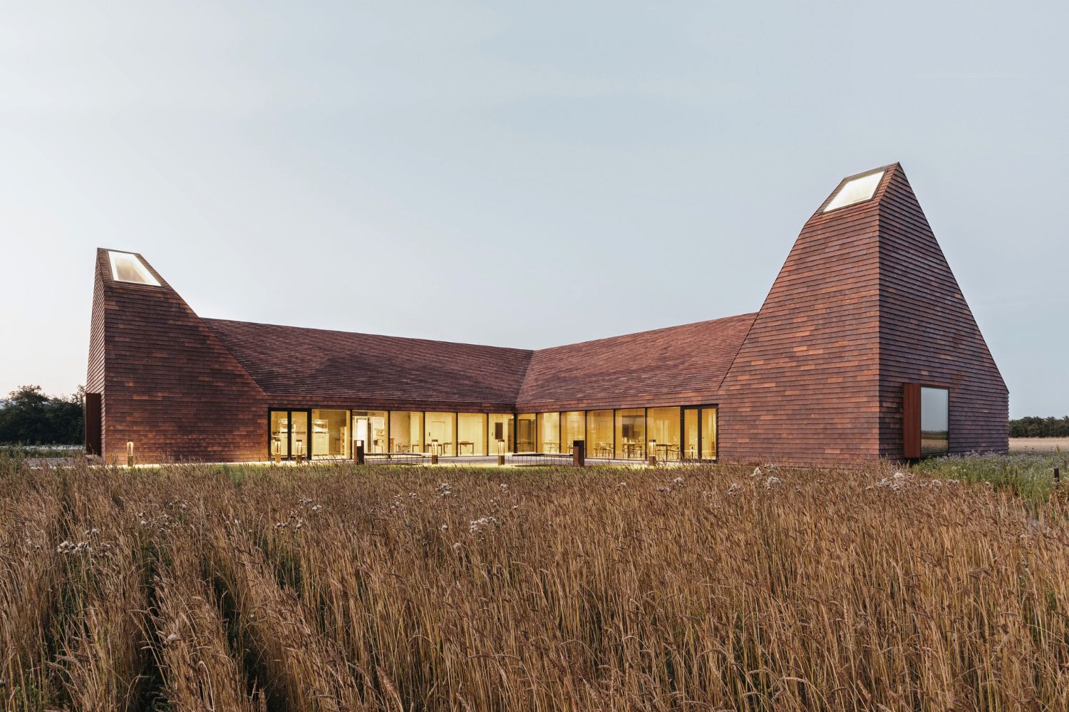 House of Grain by Reiulf Ramstad Arkitekter — The House of Grain presents two pyramidal brick towers with steeply pitched roofs, their forms dominating the flat agricultural landscape of Jutland.