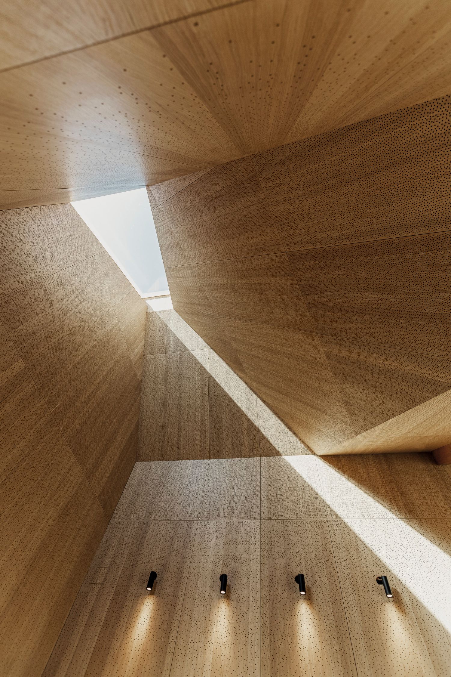 House of Grain by Reiulf Ramstad Arkitekter — This upward view captures the interior volumetric geometry of House of Grain's timber-clad spaces.
