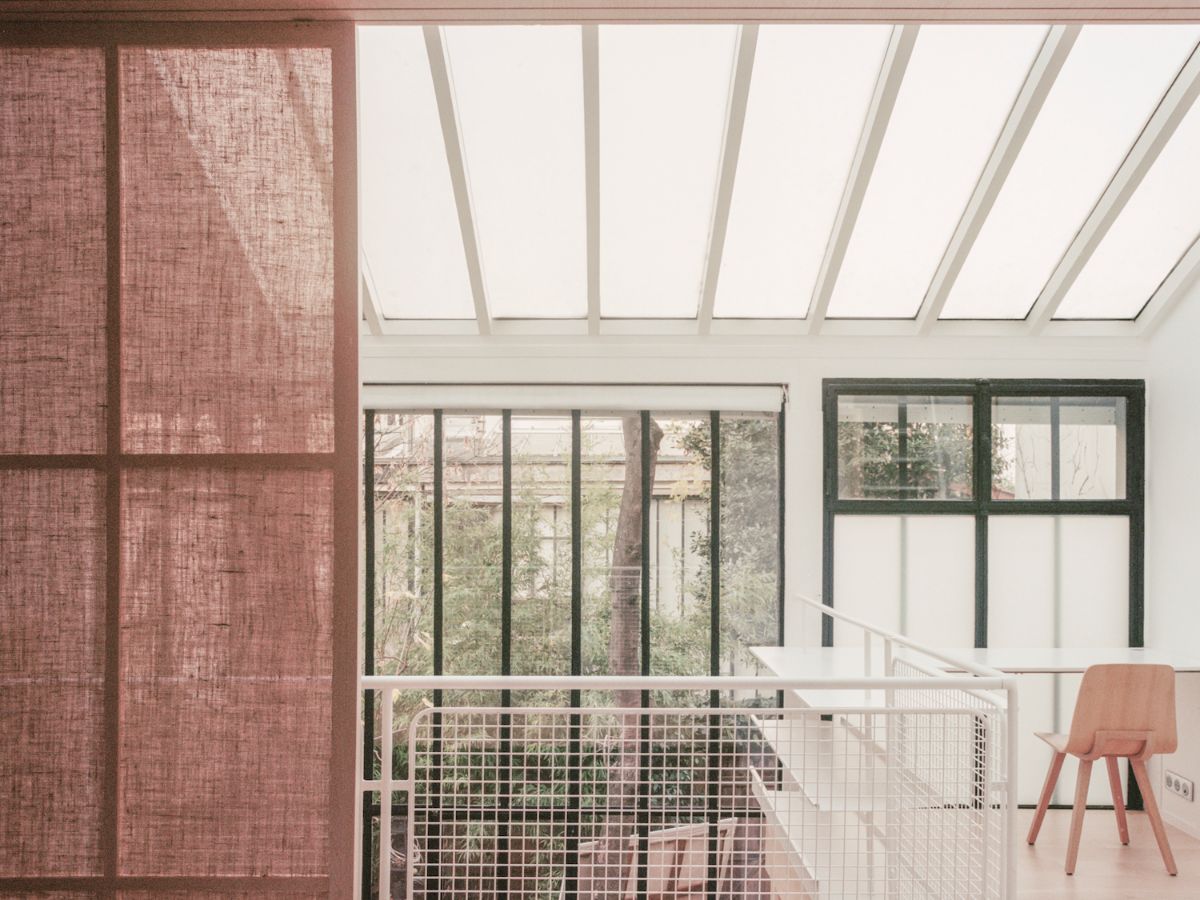 Jean Moulin Atelier – House by Atelier NEA — The studio interior demonstrates a layered approach to natural light and spatial organization.